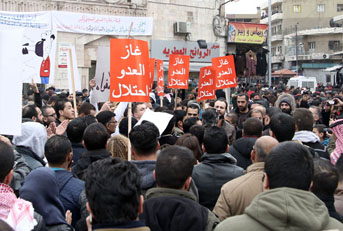 Protesters march against a deal to import gas from Israel in downtown Amman on Friday (Photo by Osama Aqarbeh)
